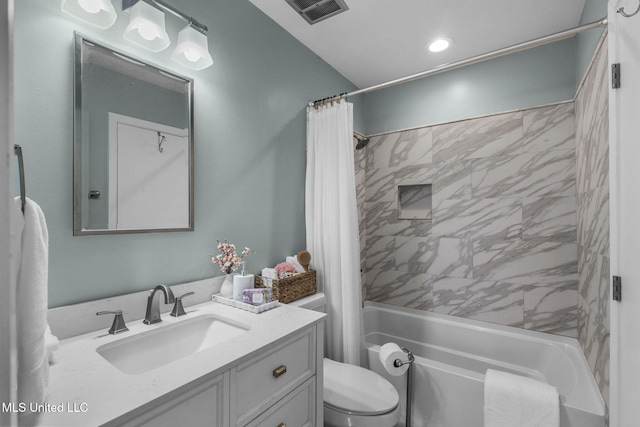 bathroom featuring visible vents, shower / bath combo, toilet, and vanity
