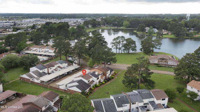 drone / aerial view featuring a residential view and a water view