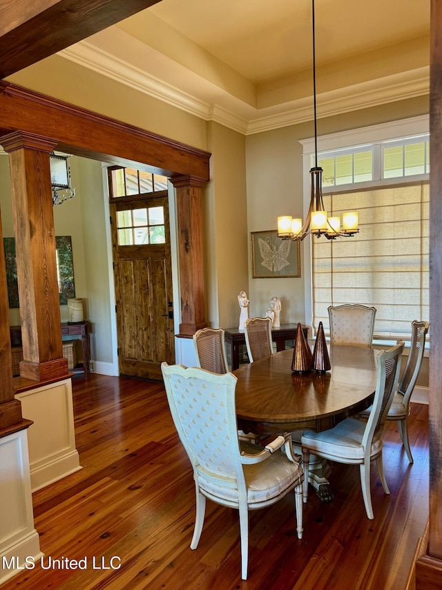 4 Mallard Xing, Raymond, MS 39154 - dining space with a chandelier, hardwood / wood-style floors, ornamental molding, decorative columns, and a raised ceiling