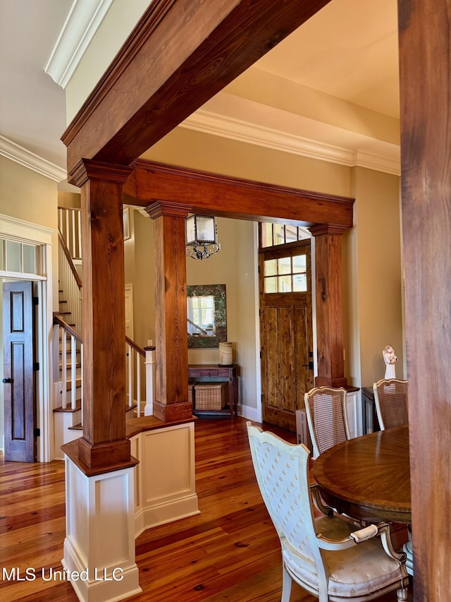 4 Mallard Xing, Raymond, MS 39154 - dining room featuring crown molding, decorative columns, stairway, and hardwood / wood-style floors
