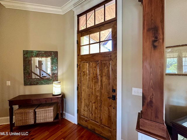 foyer with crown molding and dark hardwood / wood-style flooring