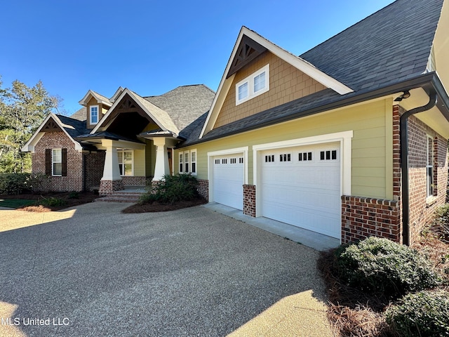 craftsman-style home with a garage