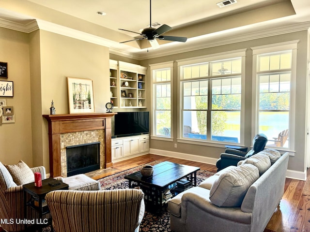 4 Mallard Xing, Raymond, MS 39154 - living room with wood finished floors, crown molding, baseboards, a fireplace, and ceiling fan