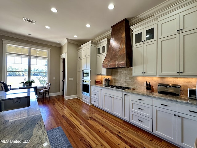 4 Mallard Xing, Raymond, MS 39154 - kitchen with a sink, custom range hood, ornamental molding, baseboards, and decorative backsplash