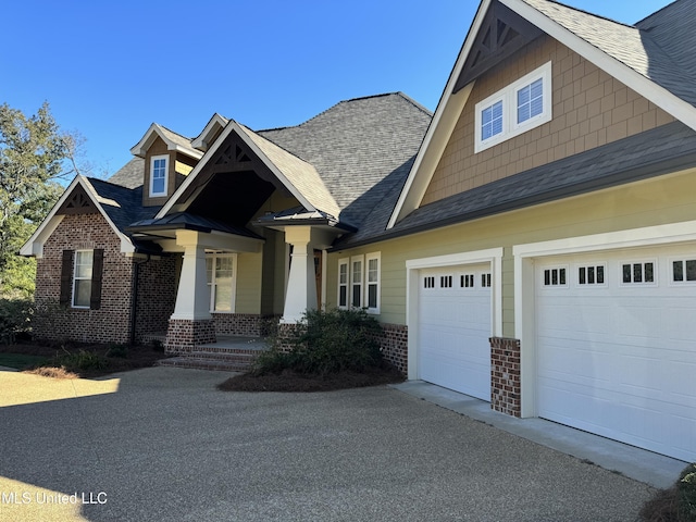 4 Mallard Xing, Raymond, MS 39154 - craftsman-style house featuring brick siding, asphalt driveway, and roof with shingles