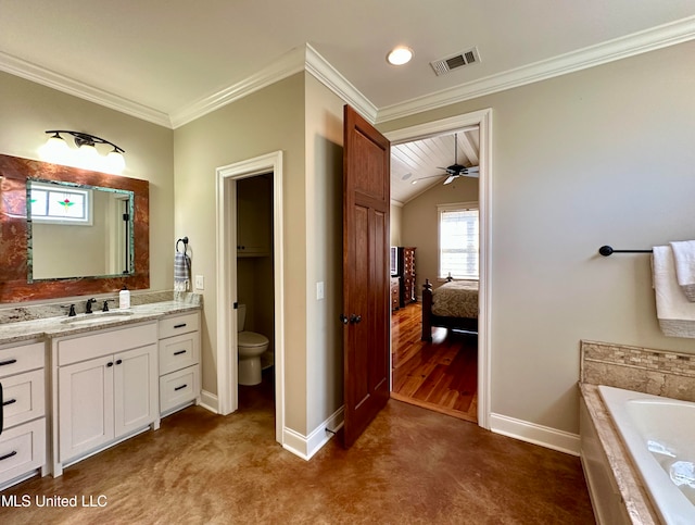 bathroom featuring ceiling fan, vaulted ceiling, toilet, vanity, and crown molding