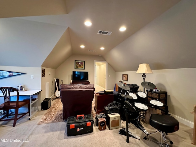 carpeted office with vaulted ceiling