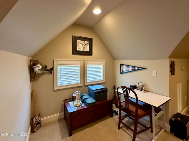 carpeted office with vaulted ceiling