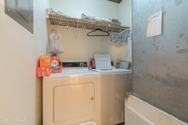 clothes washing area with independent washer and dryer