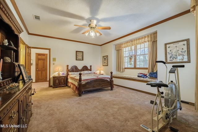 carpeted bedroom with a textured ceiling, ceiling fan, and crown molding