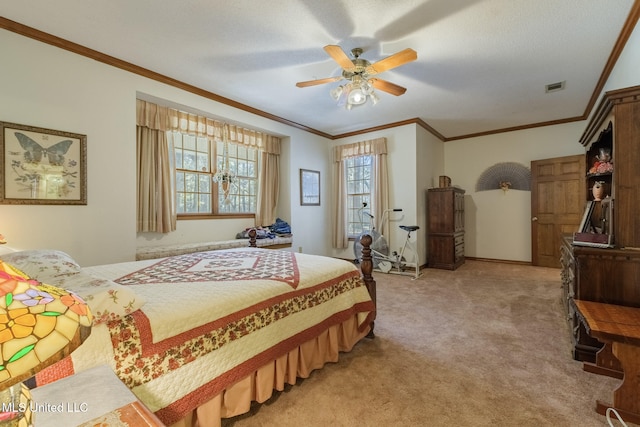 carpeted bedroom featuring ceiling fan and crown molding