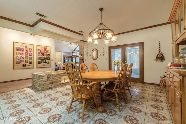 dining room with ceiling fan with notable chandelier, crown molding, and french doors