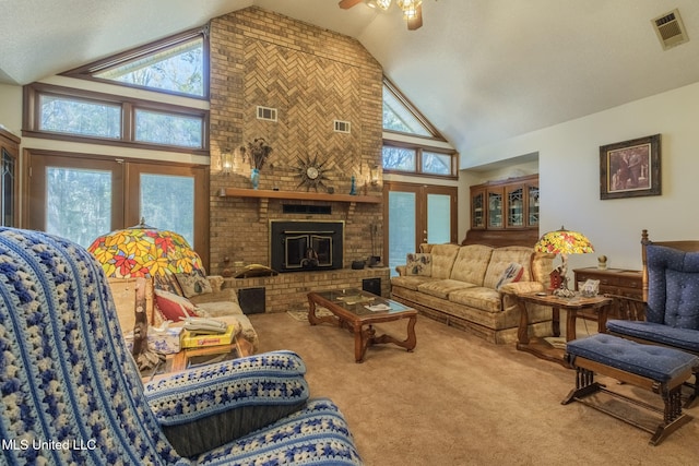 living room featuring high vaulted ceiling, a wealth of natural light, and french doors