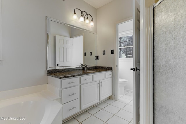 full bathroom featuring toilet, shower with separate bathtub, tile patterned floors, and vanity