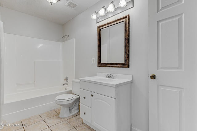 full bathroom featuring toilet, vanity, tile patterned floors, shower / washtub combination, and a textured ceiling