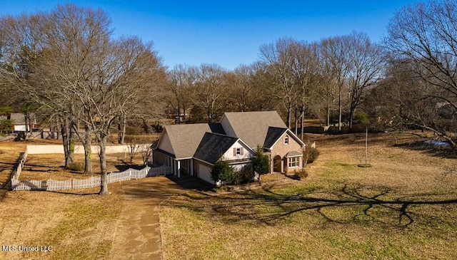 view of side of property featuring a yard