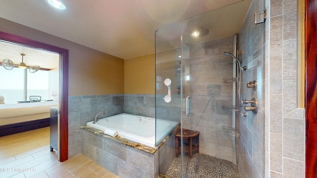 bathroom with a water view and shower with separate bathtub