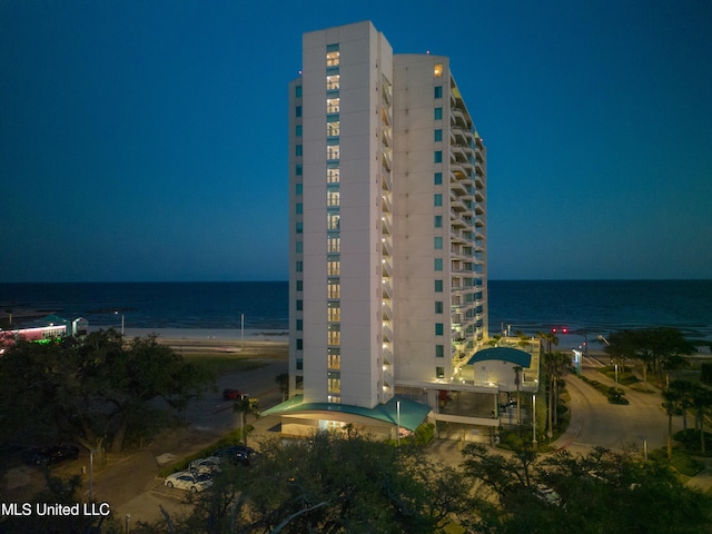 view of building exterior with a water view