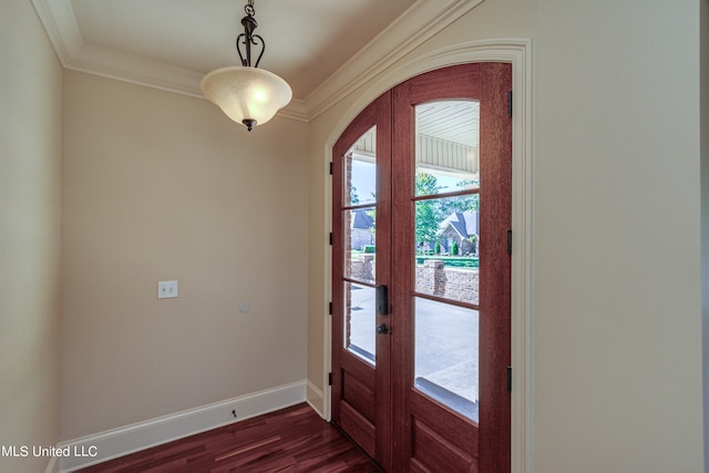 foyer entrance with ornamental molding, dark wood-type flooring, and french doors