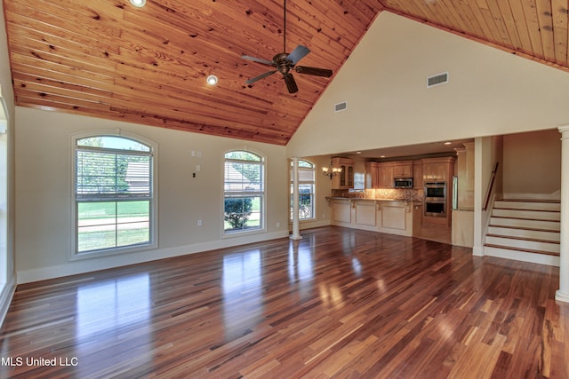 unfurnished living room featuring wood-type flooring, wooden ceiling, decorative columns, high vaulted ceiling, and ceiling fan