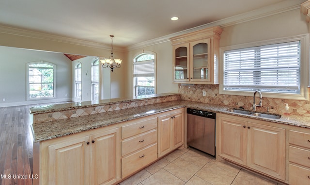 kitchen featuring light hardwood / wood-style flooring, dishwasher, tasteful backsplash, and sink