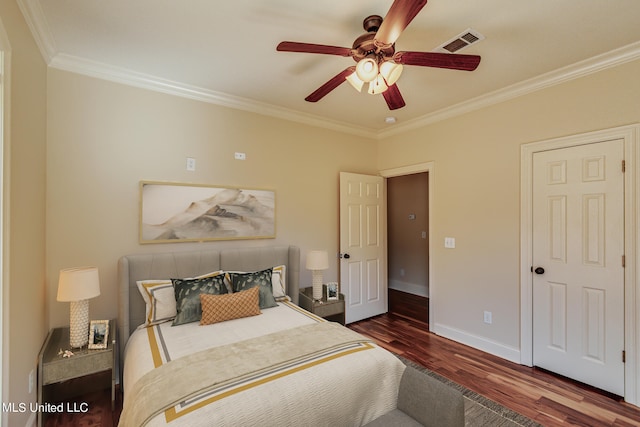 bedroom featuring ornamental molding, dark wood-type flooring, and ceiling fan