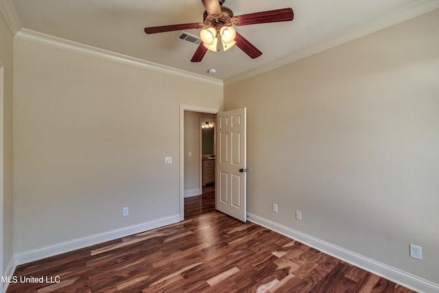 empty room featuring ornamental molding, dark hardwood / wood-style floors, and ceiling fan