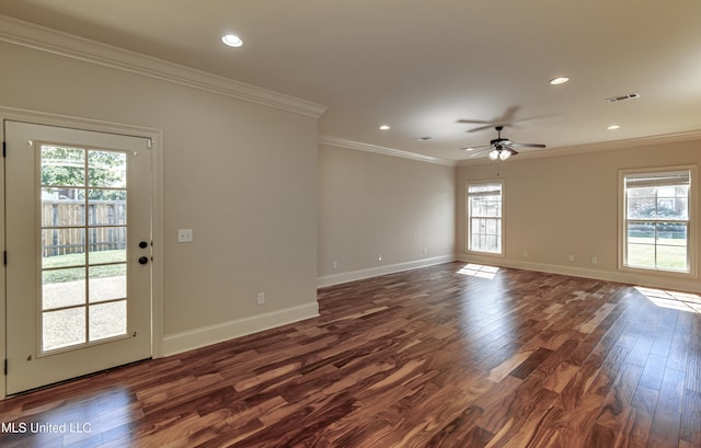 unfurnished room with crown molding, dark hardwood / wood-style floors, a healthy amount of sunlight, and ceiling fan