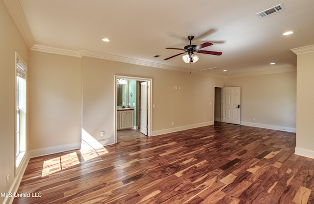 spare room with ceiling fan, ornamental molding, dark hardwood / wood-style flooring, and a wealth of natural light