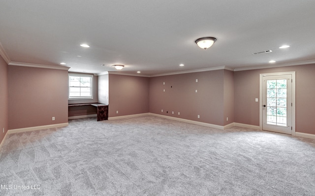 interior space featuring ornamental molding and light colored carpet