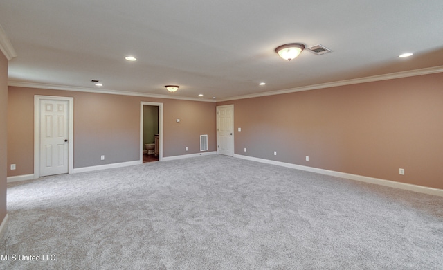 unfurnished room featuring light carpet and ornamental molding