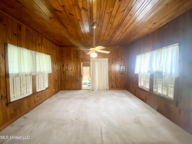 613 Georgetown St, Hazlehurst, MS 39083 - empty room featuring wooden ceiling, wood walls, and a ceiling fan