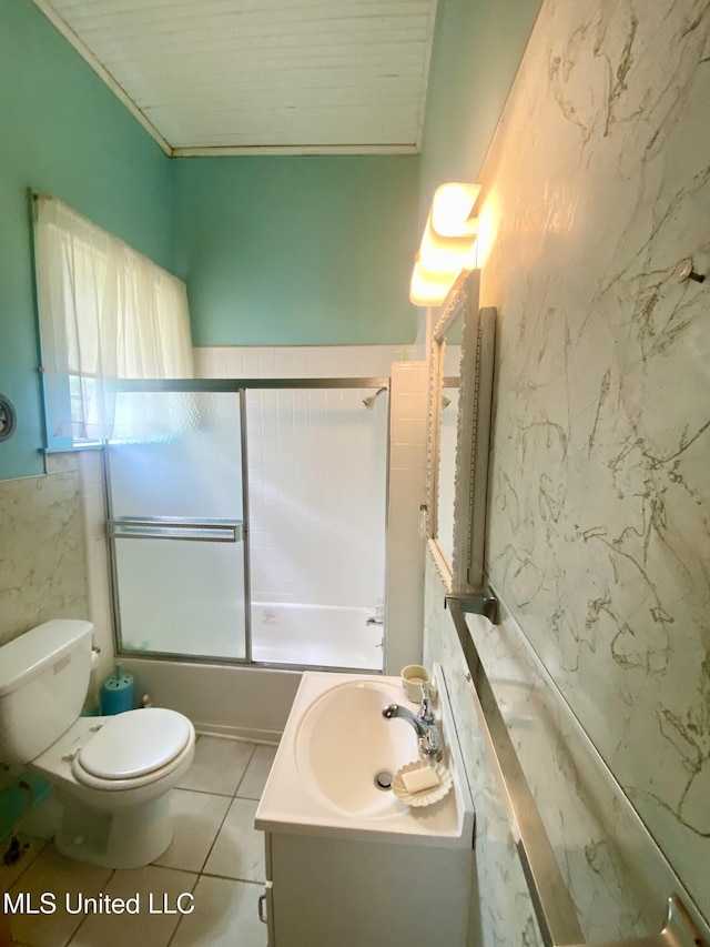 613 Georgetown St, Hazlehurst, MS 39083 - full bath with vanity, tile walls, toilet, shower / bath combination with glass door, and tile patterned flooring
