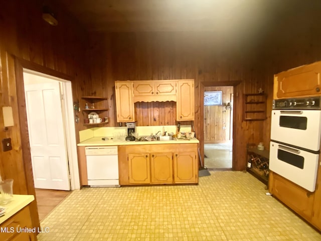 613 Georgetown St, Hazlehurst, MS 39083 - kitchen featuring white appliances, wood walls, light countertops, light flooring, and open shelves