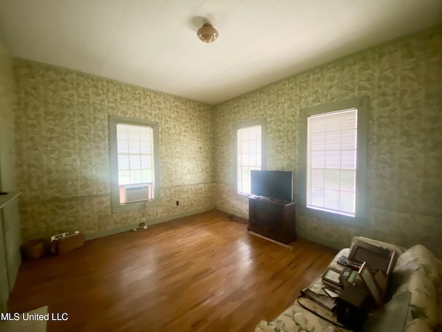 613 Georgetown St, Hazlehurst, MS 39083 - unfurnished living room featuring wood finished floors and wallpapered walls