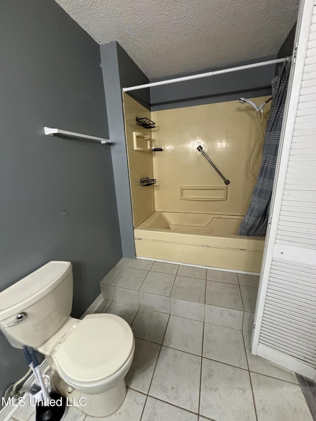 bathroom with shower / bath combination with curtain, a textured ceiling, toilet, and tile patterned flooring