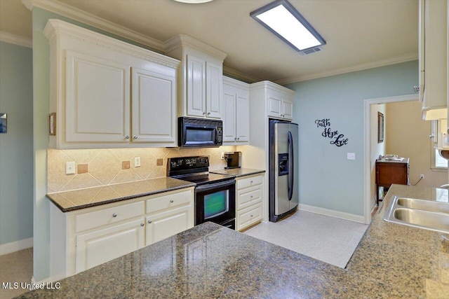 kitchen with crown molding, black appliances, a sink, and decorative backsplash