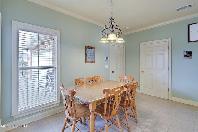 dining room with light tile patterned flooring, baseboards, visible vents, and ornamental molding