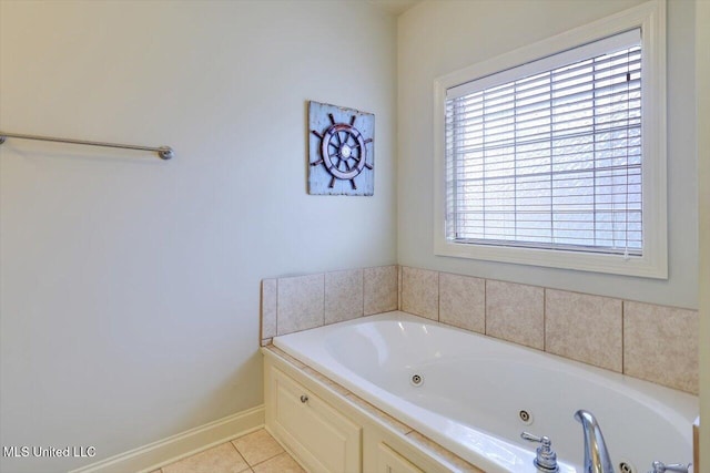 bathroom featuring a jetted tub, tile patterned flooring, and baseboards