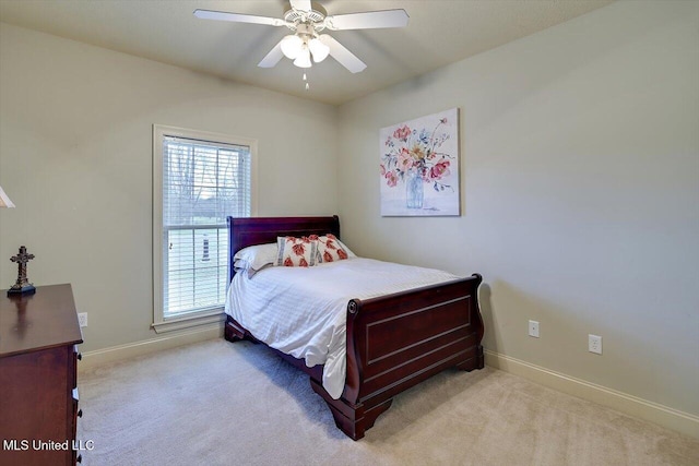 bedroom featuring a ceiling fan, carpet, and baseboards