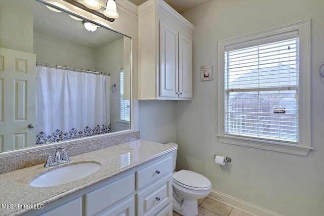 full bath with toilet, vanity, tile patterned flooring, and a wealth of natural light