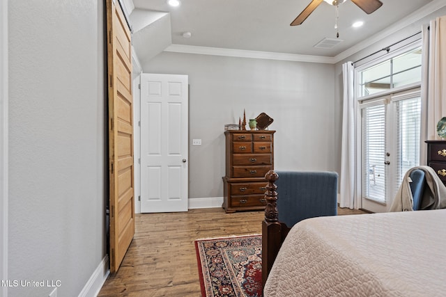 bedroom featuring visible vents, baseboards, access to outside, ornamental molding, and light wood finished floors