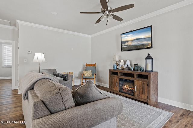 living room featuring baseboards, dark wood-type flooring, and crown molding