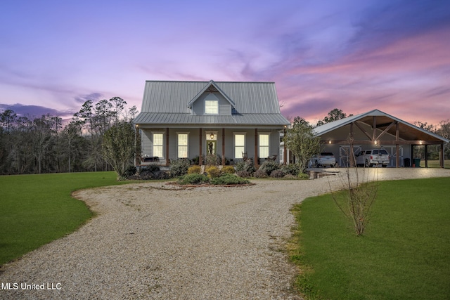 view of front of house featuring a porch, gravel driveway, a lawn, and a carport