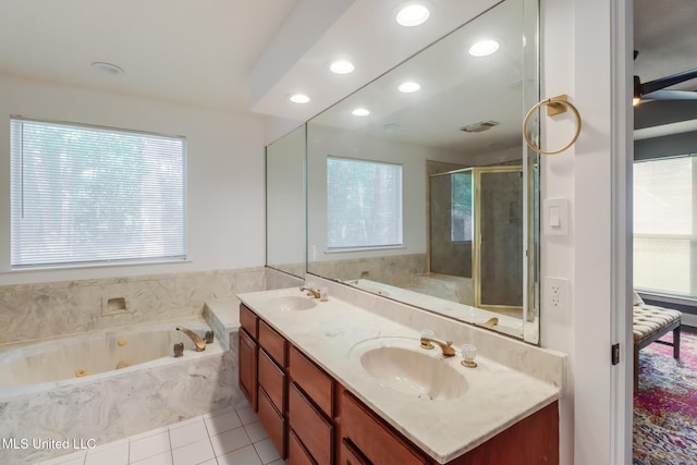 full bath with a shower stall, a whirlpool tub, tile patterned floors, double vanity, and recessed lighting
