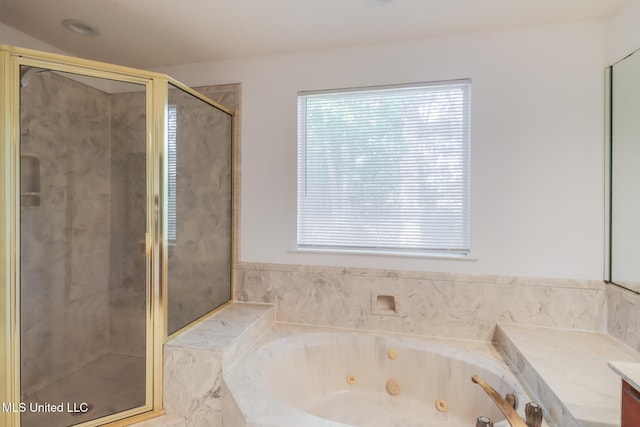full bathroom featuring a stall shower, a whirlpool tub, and vanity