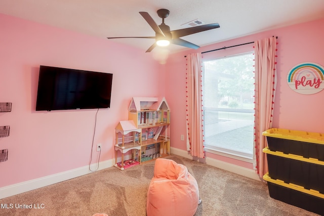rec room featuring ceiling fan, carpet flooring, and baseboards