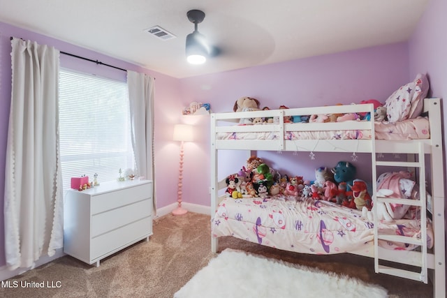 carpeted bedroom with baseboards and a ceiling fan