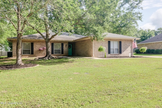 single story home with a front lawn and brick siding