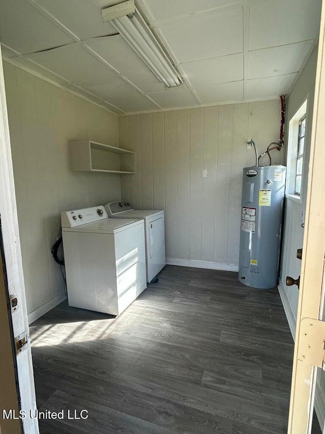 washroom featuring dark hardwood / wood-style floors, separate washer and dryer, and water heater